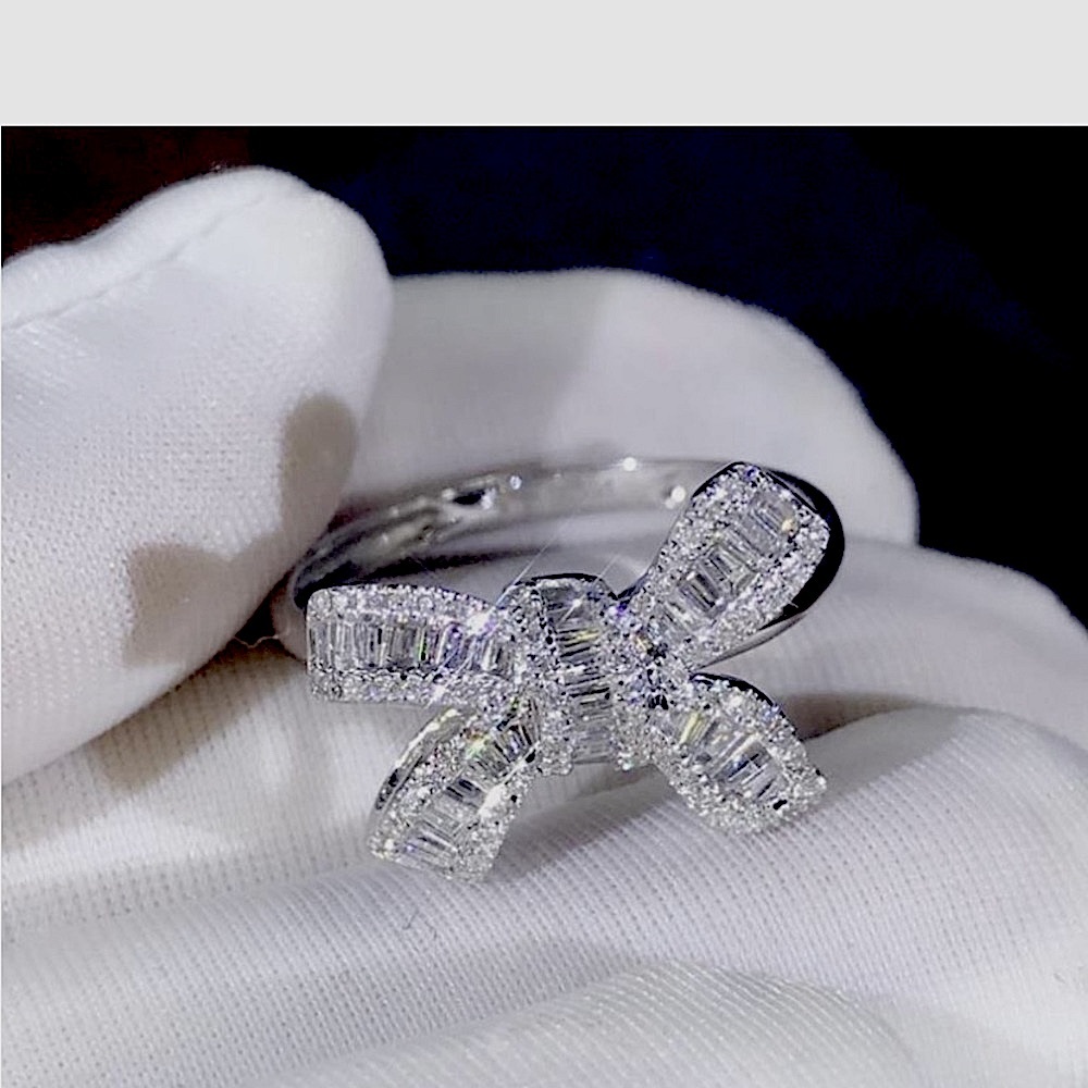 Brand new size 6 rhodium plated white sapphire cute bow ring